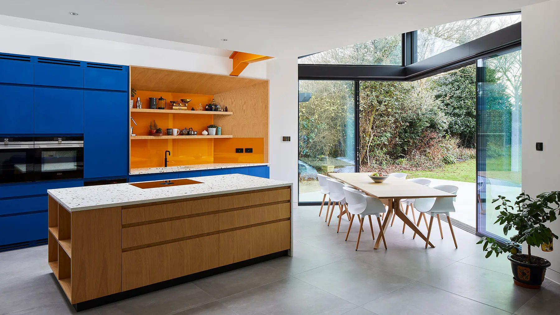 Wide view across the kitchen and glazed dining space